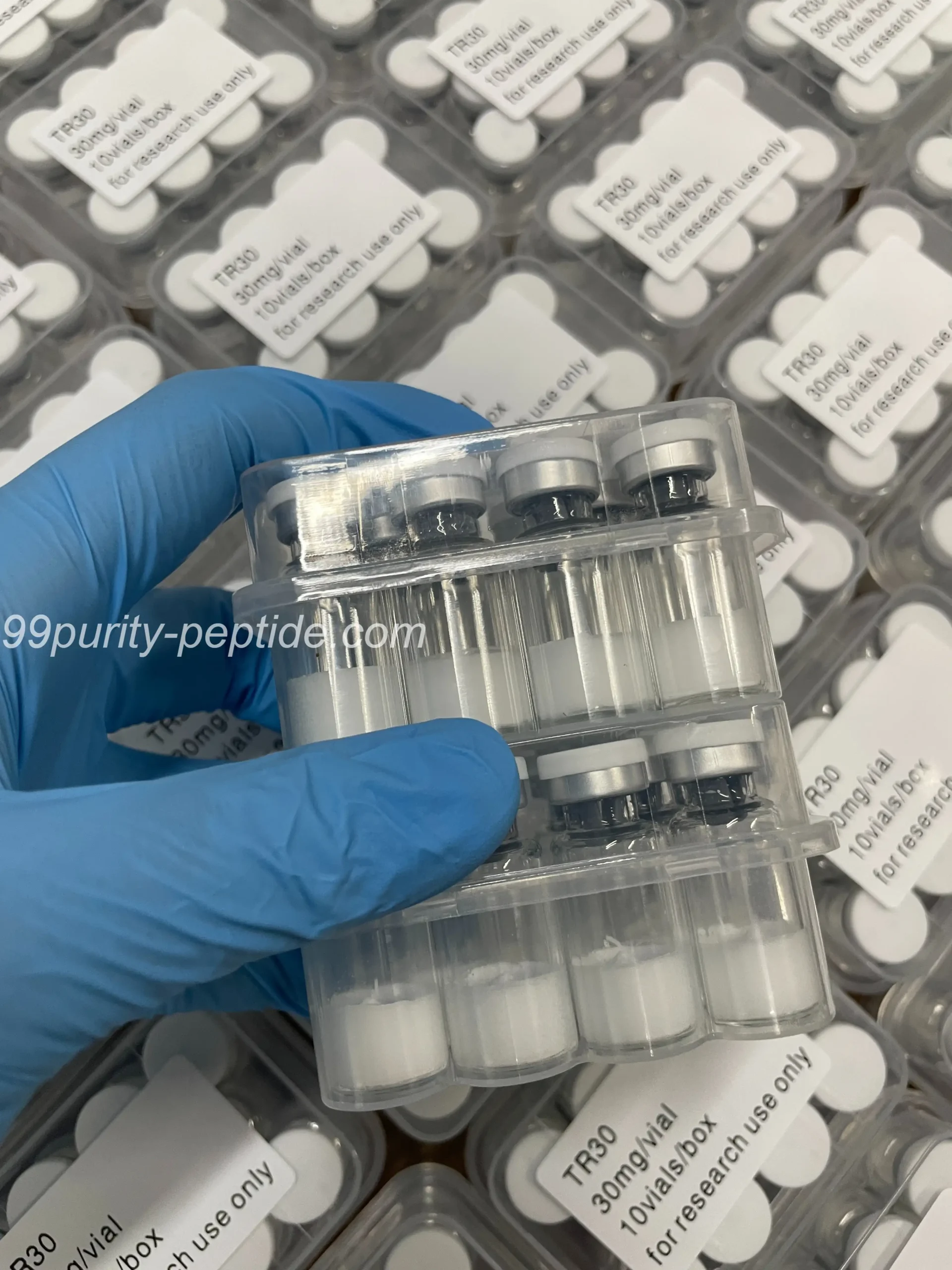 Handheld Dulaglutide 5mg vial at 99Purity-Peptide warehouse for weight research stock.