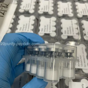 Handheld HMG 75iu vial at 99Purity-Peptide warehouse, showcasing authentic pct stock.