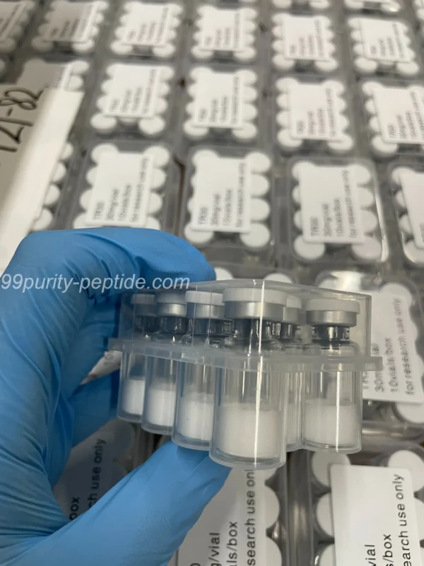 Handheld HMG 75iu vial at 99Purity-Peptide warehouse, showcasing authentic pct stock.
